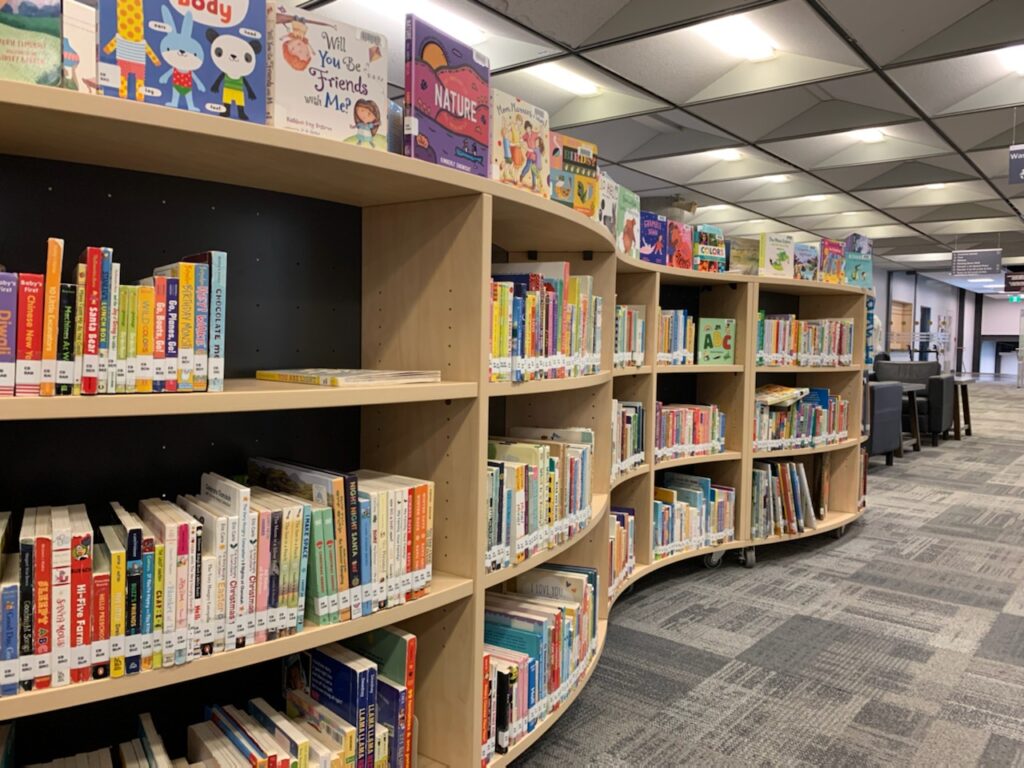 Image of bookshelf that has a wave pattern